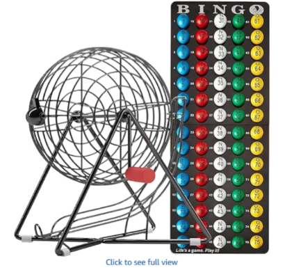 A large black and silver spinning wheel drum with tray of colorful bingo balls and display stand